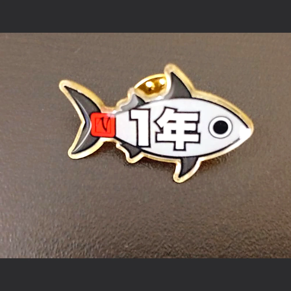 Pin conmemorativo de aniversario